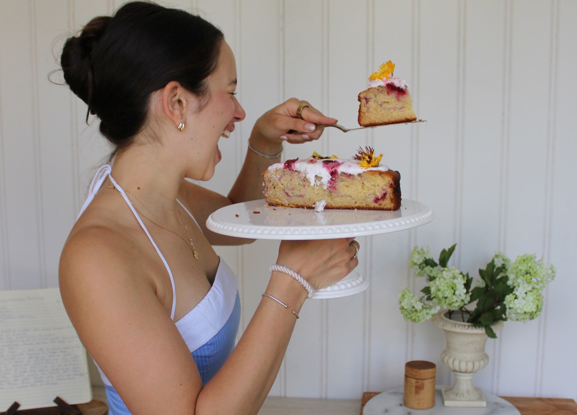 Lauren serving a slice of cake